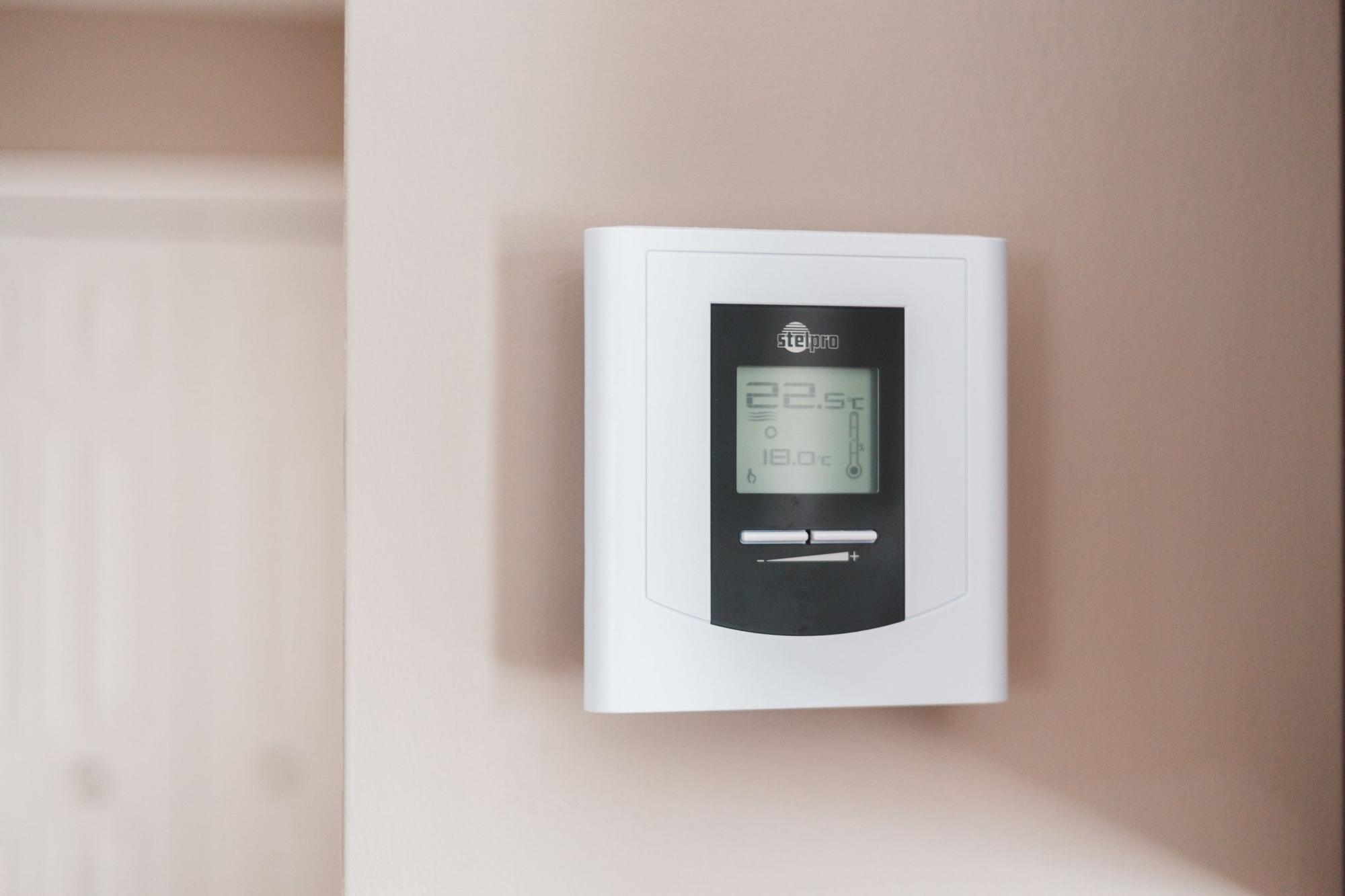 Wall-mounted smart thermostat
